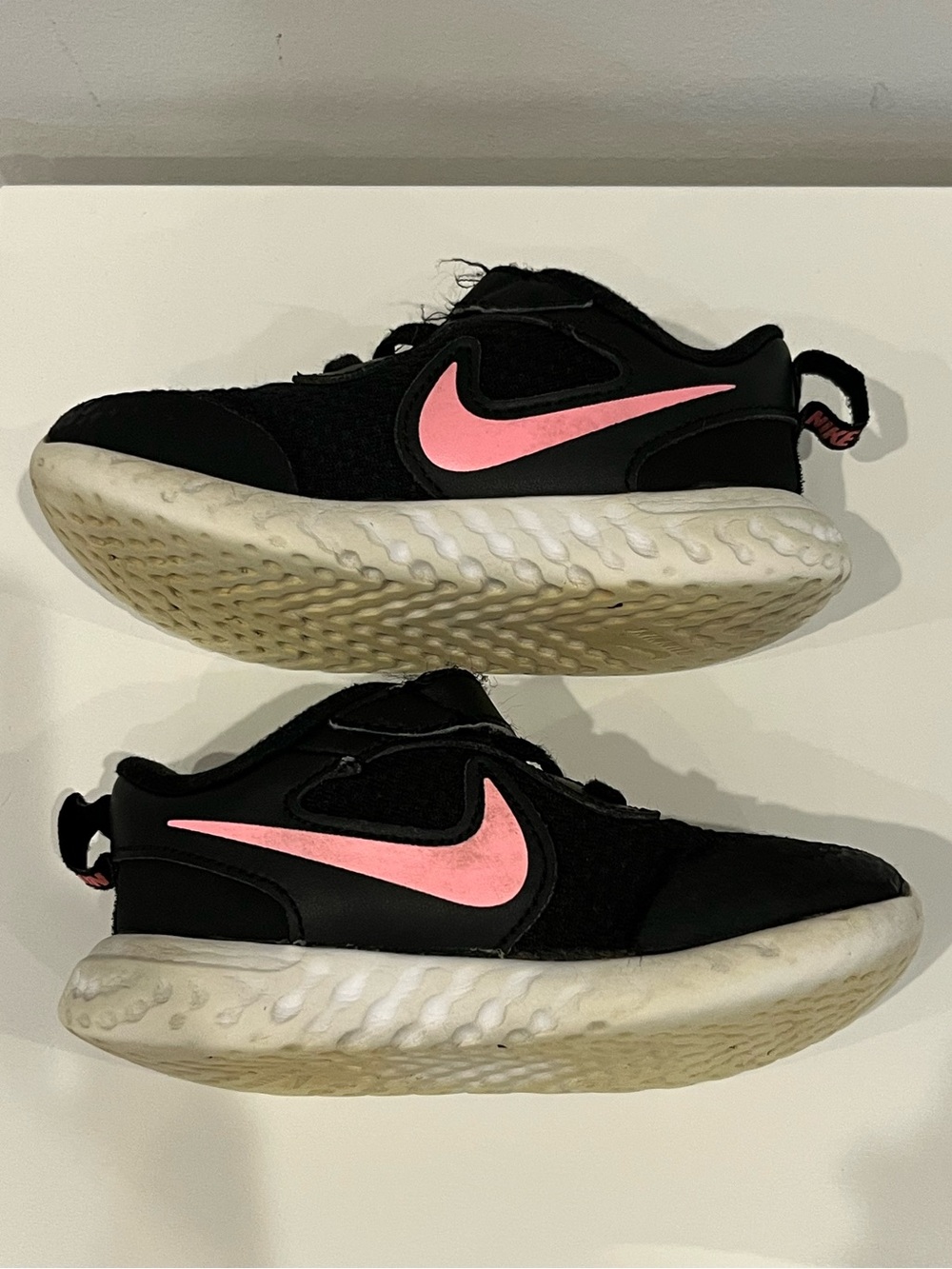 Nike Toddler Black Sneakers with Pink Swoosh Accent